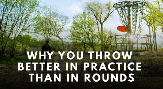Red disc going into the disc golf basket
